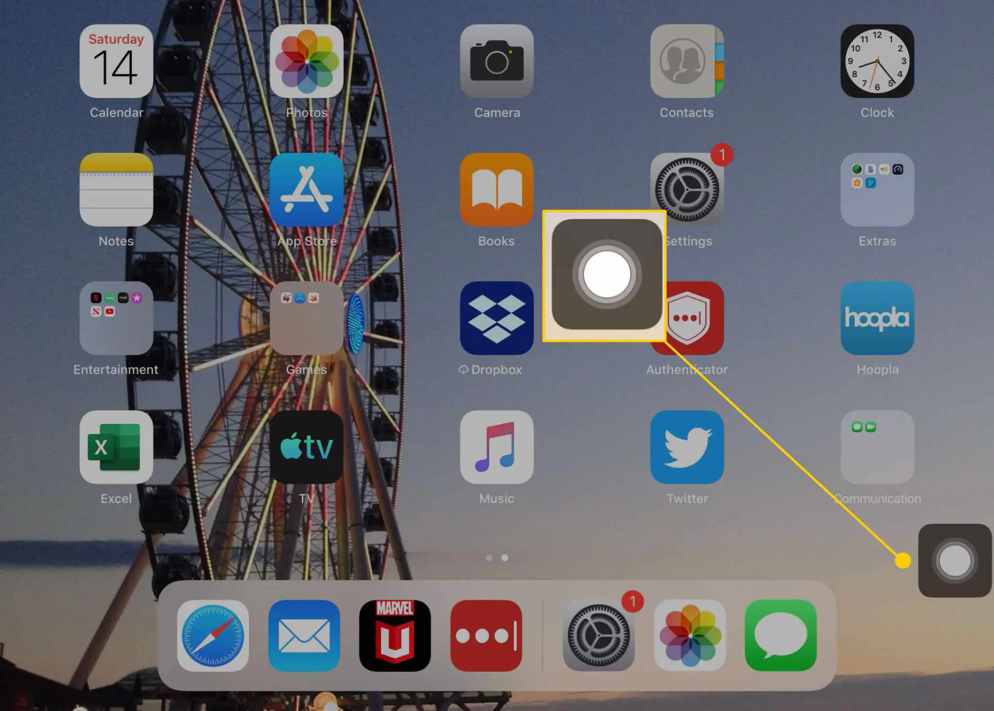 A tela inicial de um iPad com o botão AssistiveTouch destacado