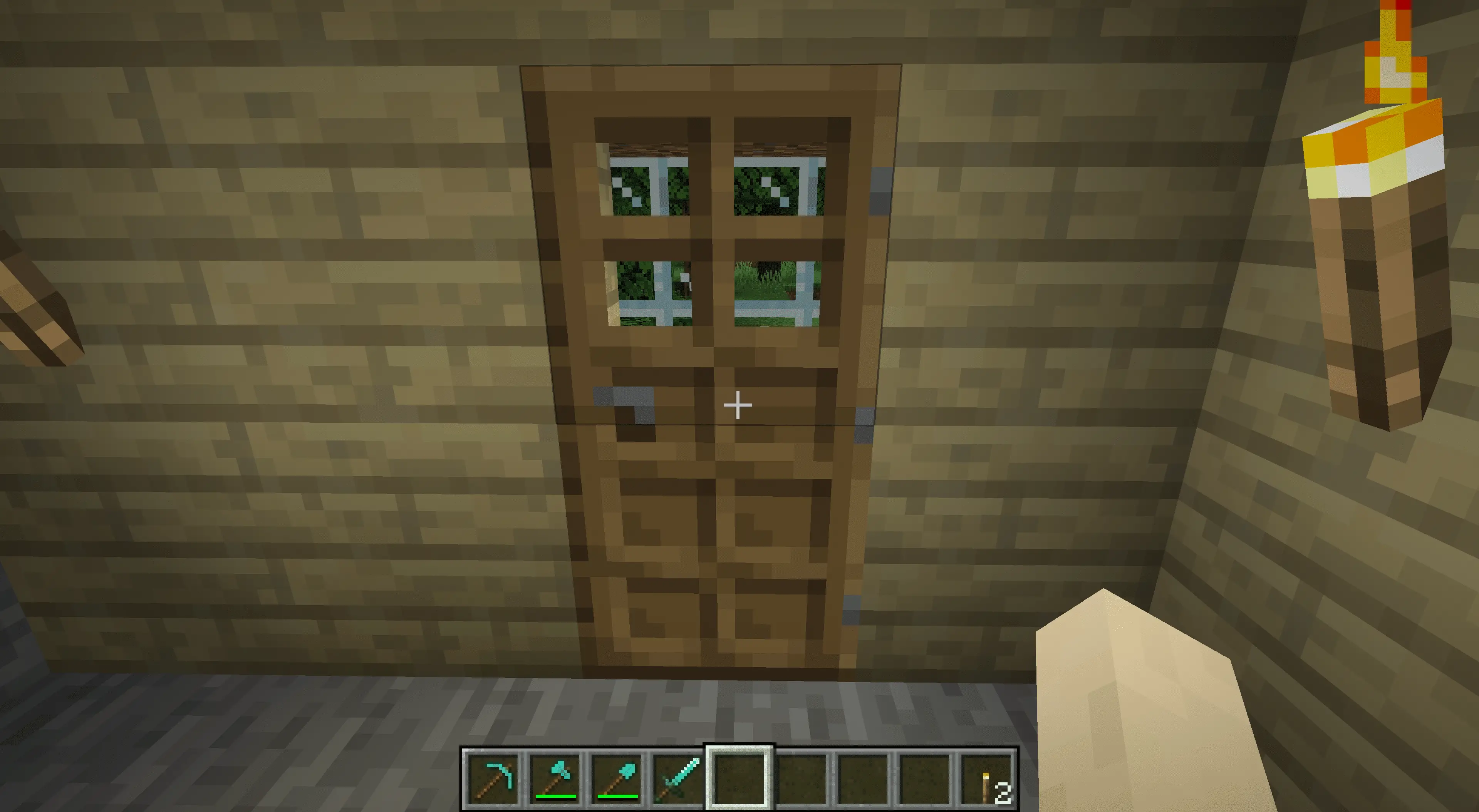 Uma porta que leva a uma mina no Minecraft.