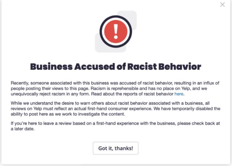 Uma imagem do alerta de 'Comportamento Racista' do Yelp.